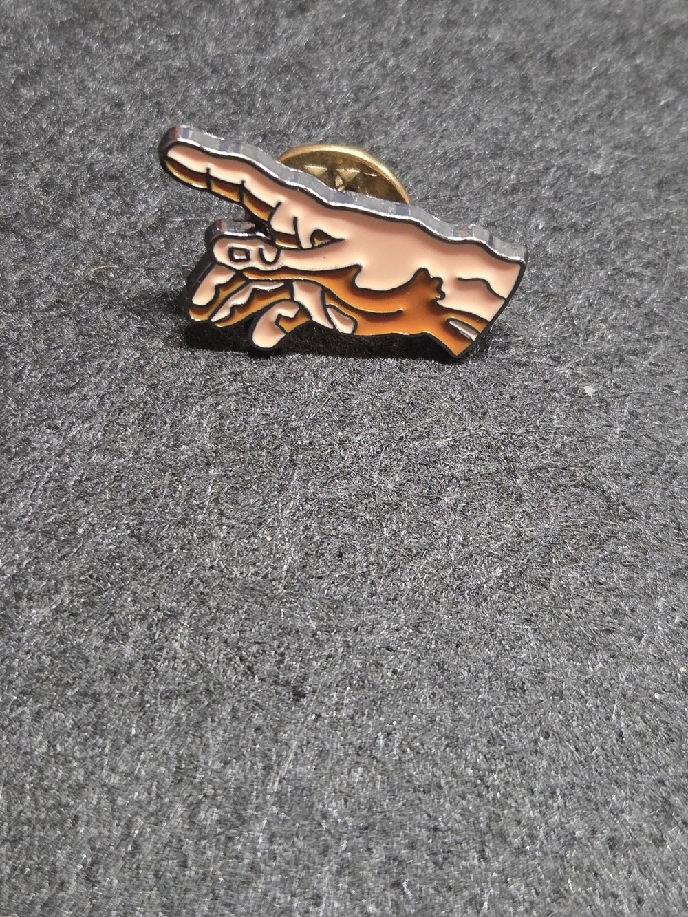 **Enamel Pointing Hand Lapel Pin - Black and Tan**